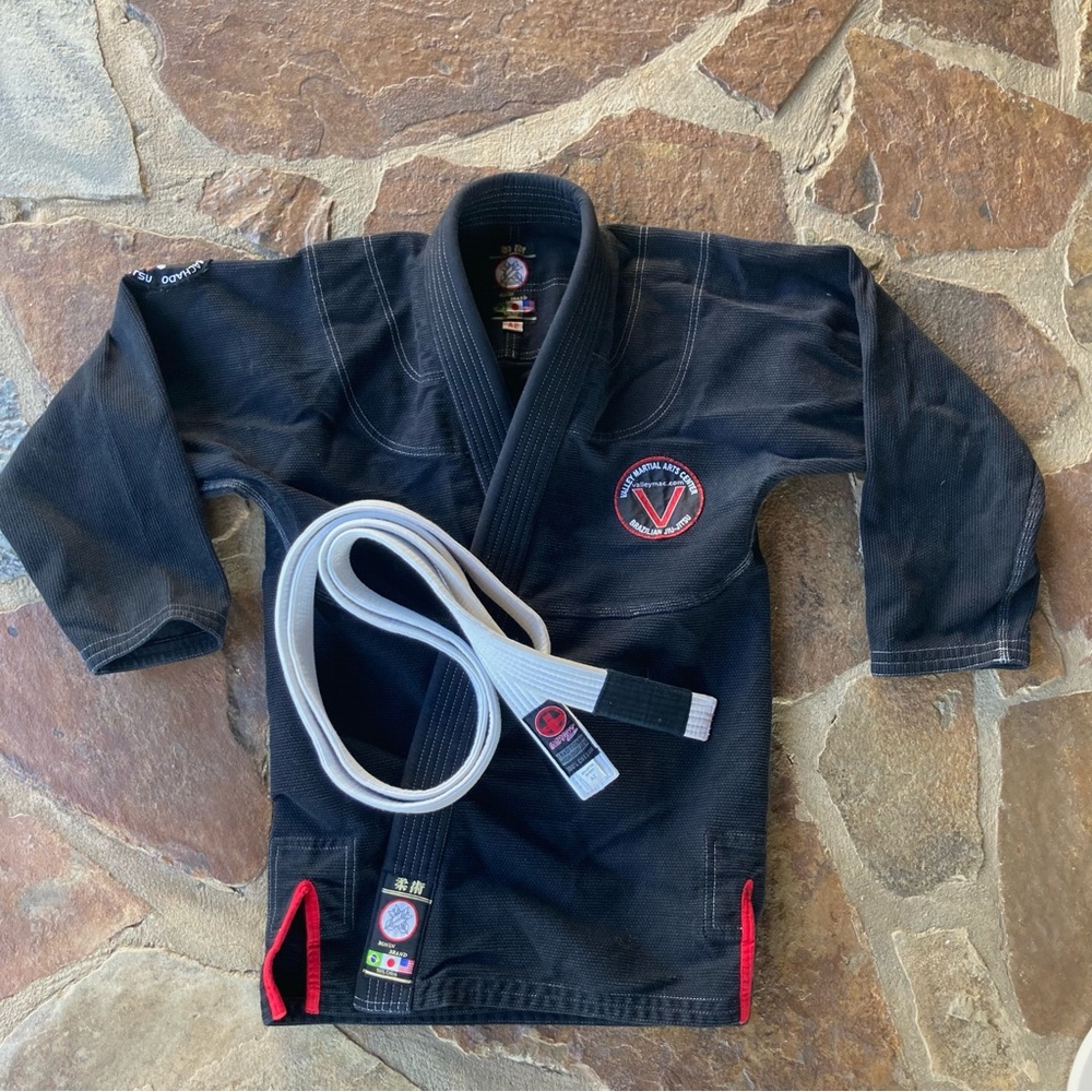 Black Martial Arts Gi with White Belt.